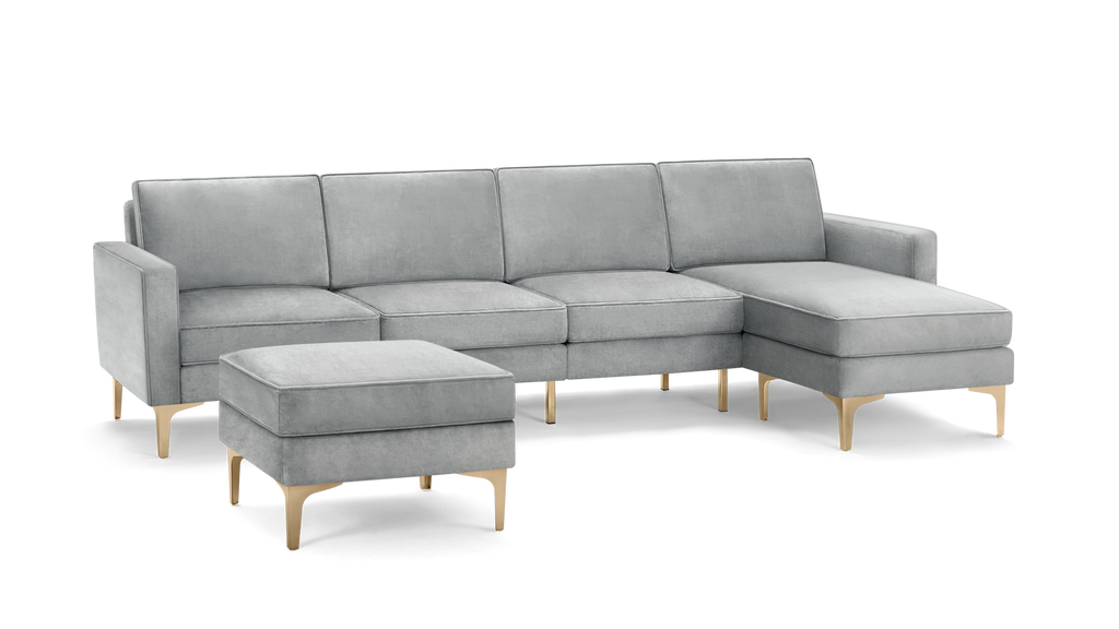 modern light gray velvet sectional sofa with matching ottoman, featuring tapered wooden legs, and matching cushioned seats