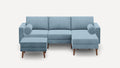 light blue sectional sofa with matching ottoman and wooden legs, featuring a rounded backrest, and matching ottoman on both sides