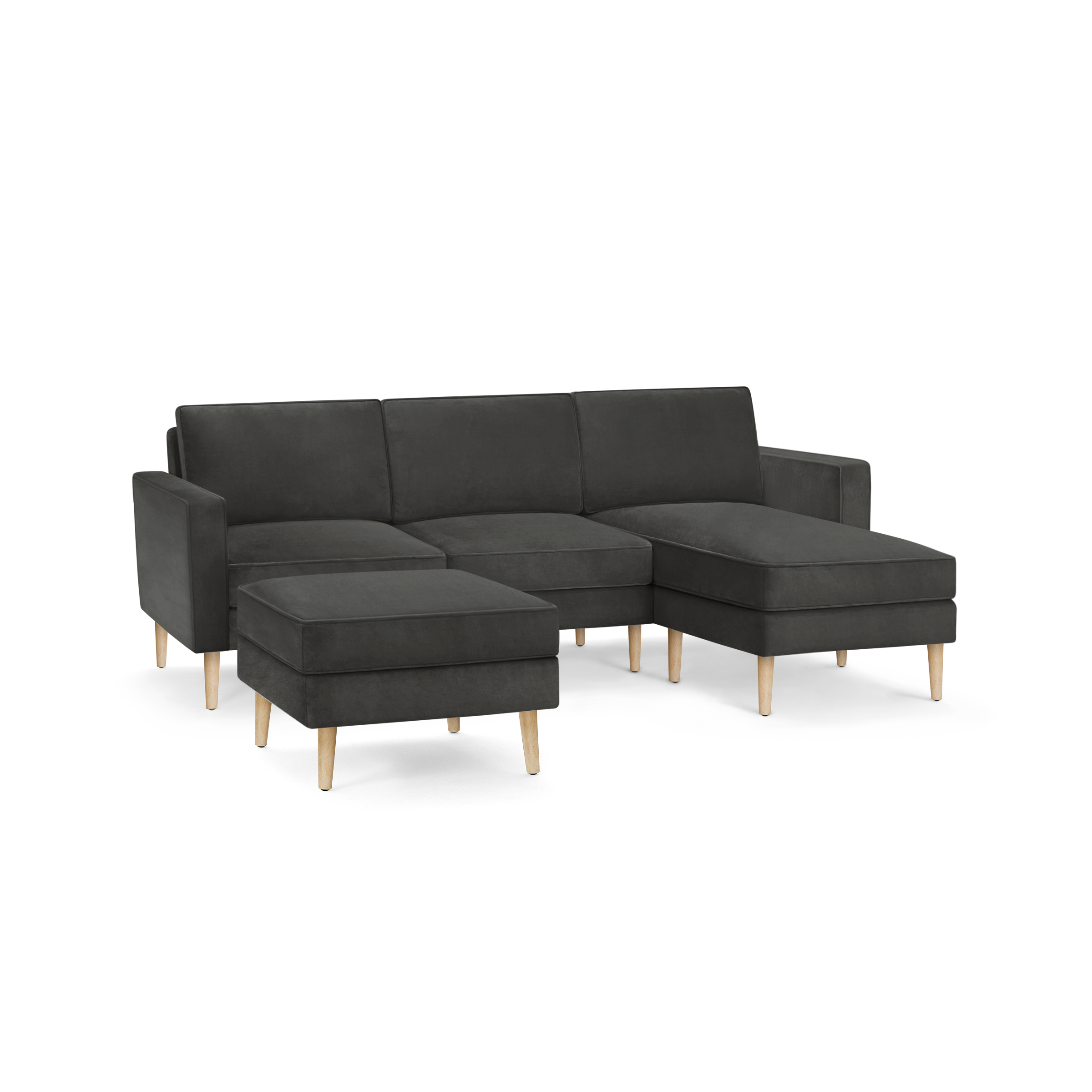 modern dark gray sectional sofa with wooden legs and matching ottoman, featuring a clean, minimal design
