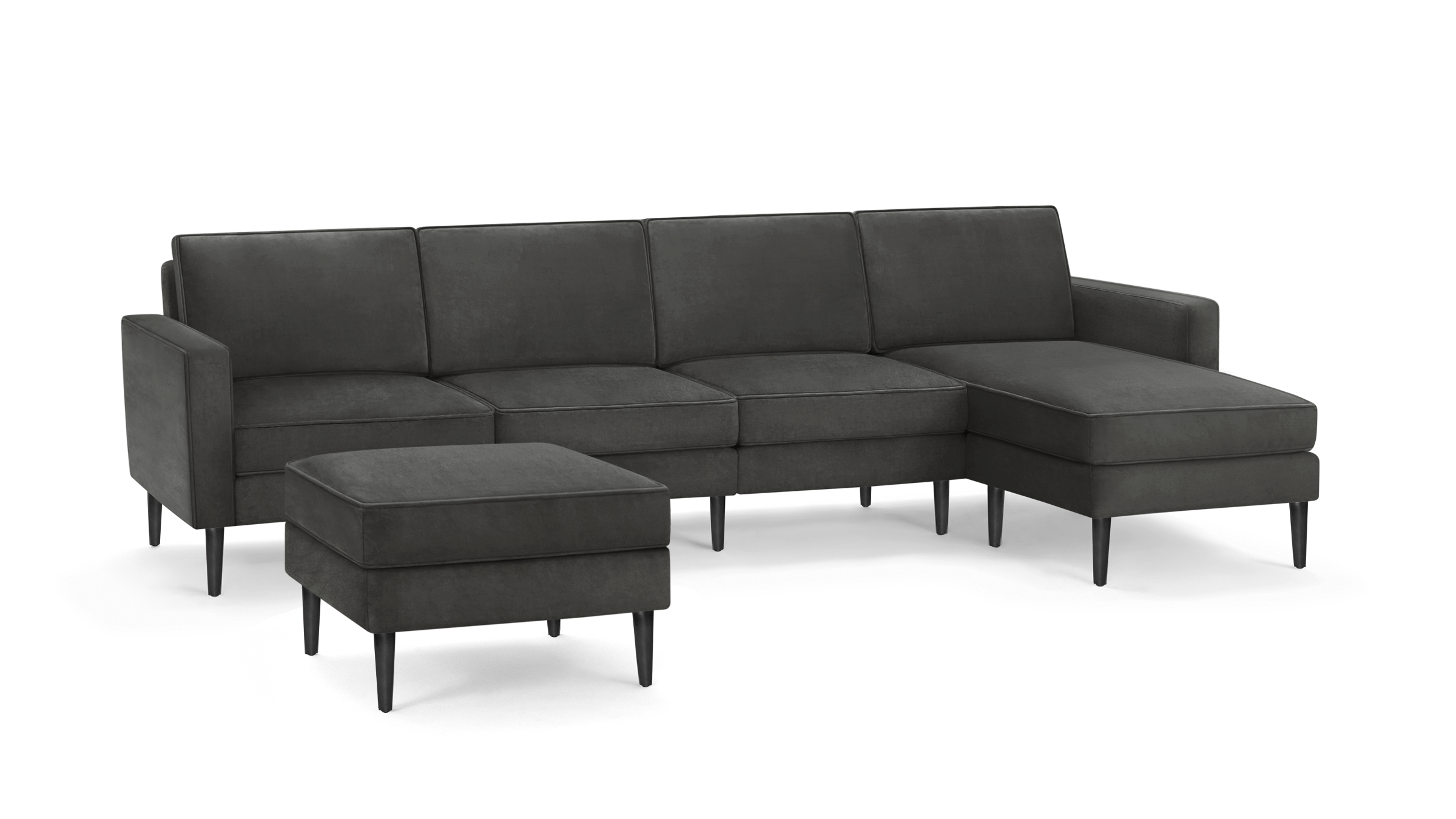modern dark gray fabric sectional sofa with matching ottoman, featuring tapered wooden legs, and clean lines on the back