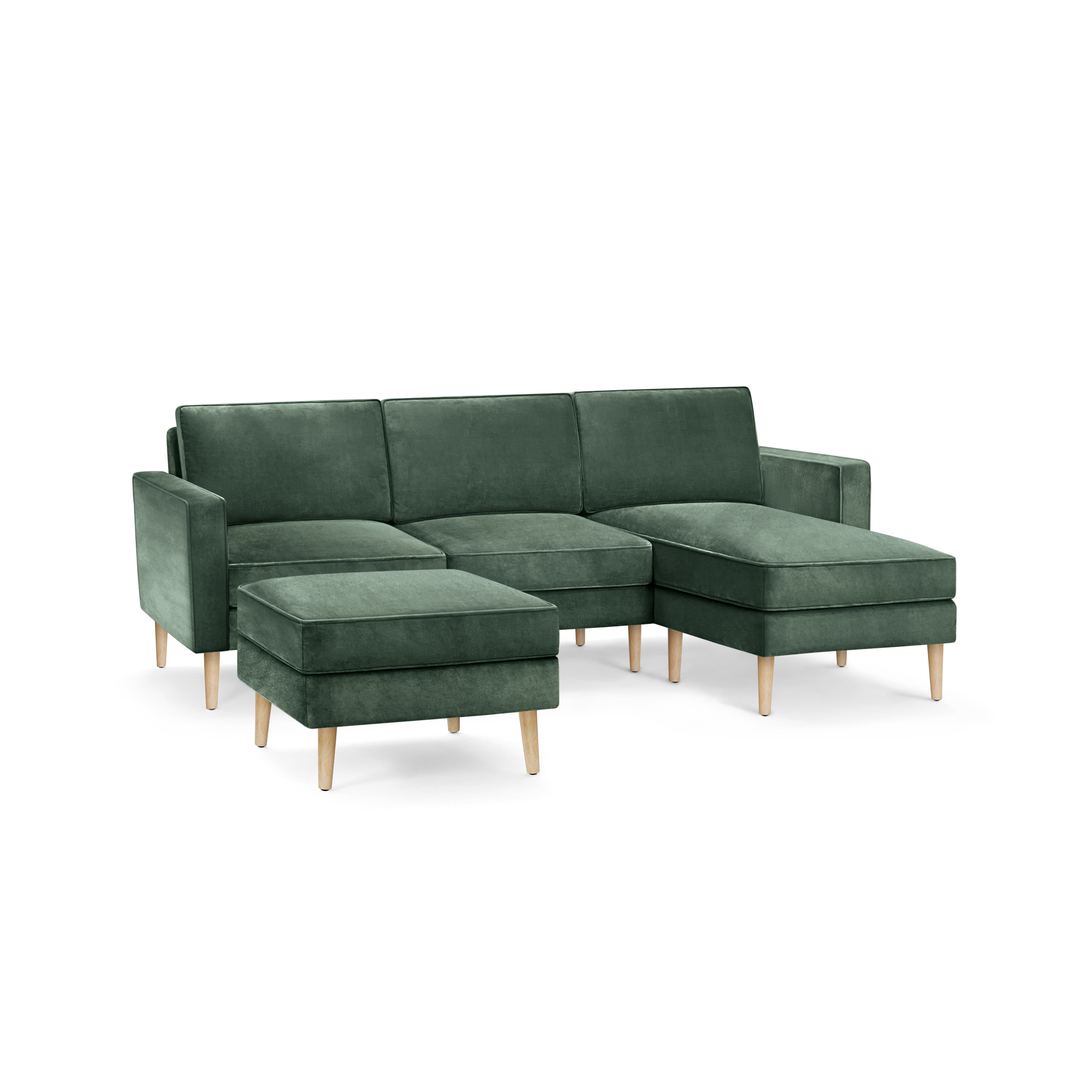 modern green velvet sectional sofa with wooden legs and matching ottoman, featuring a clean, minimal design