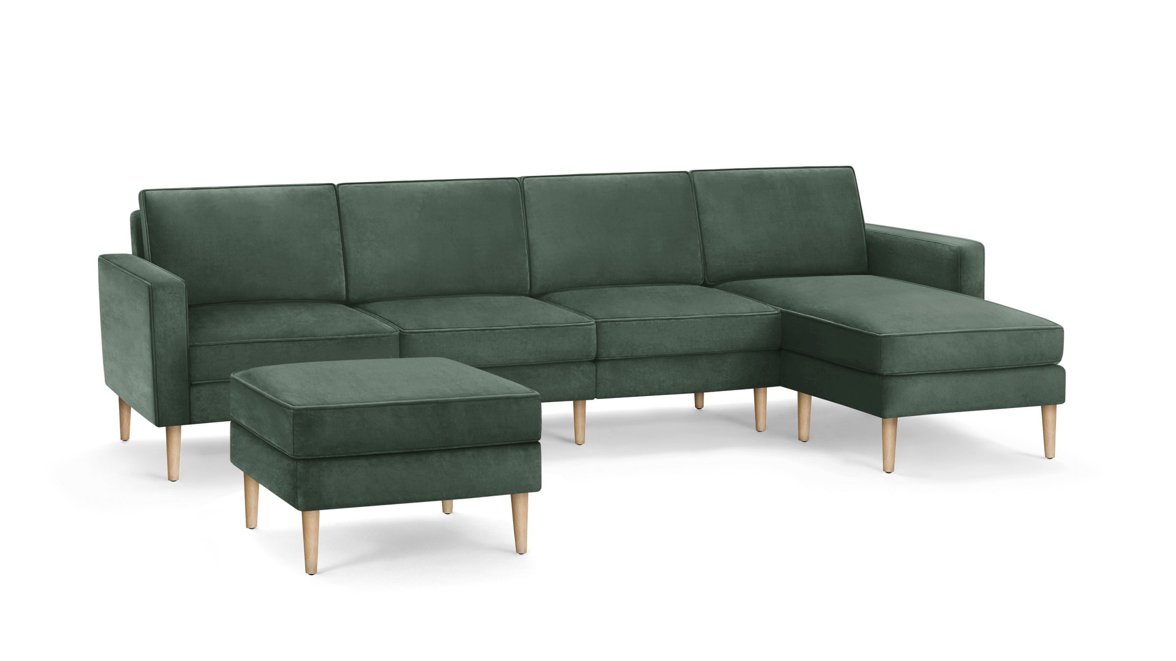 modern green velvet sectional sofa with wooden legs and matching ottoman, featuring a clean, minimalist design