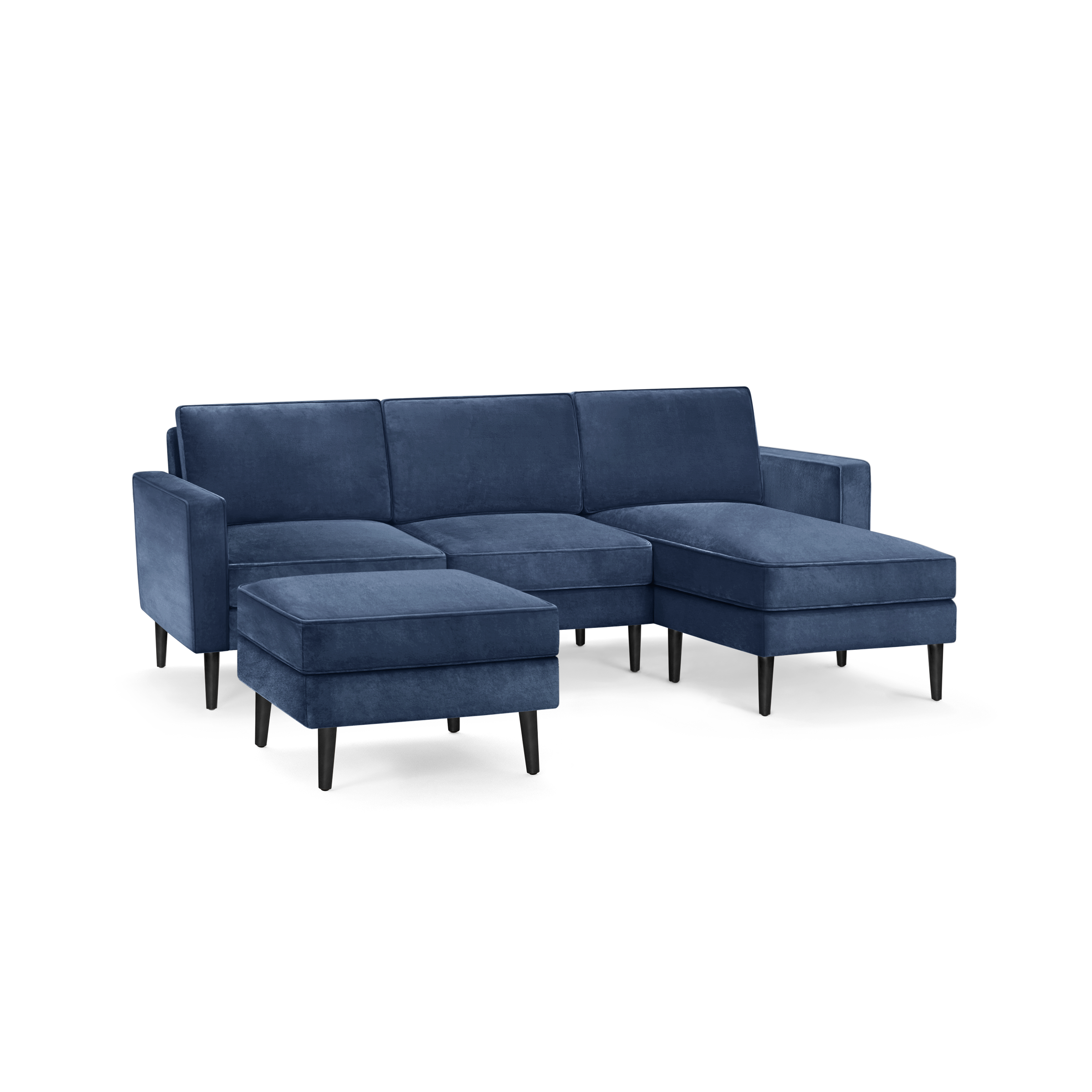 modern blue velvet sectional sofa with black metal legs and matching ottoman, featuring a clean, minimalist design