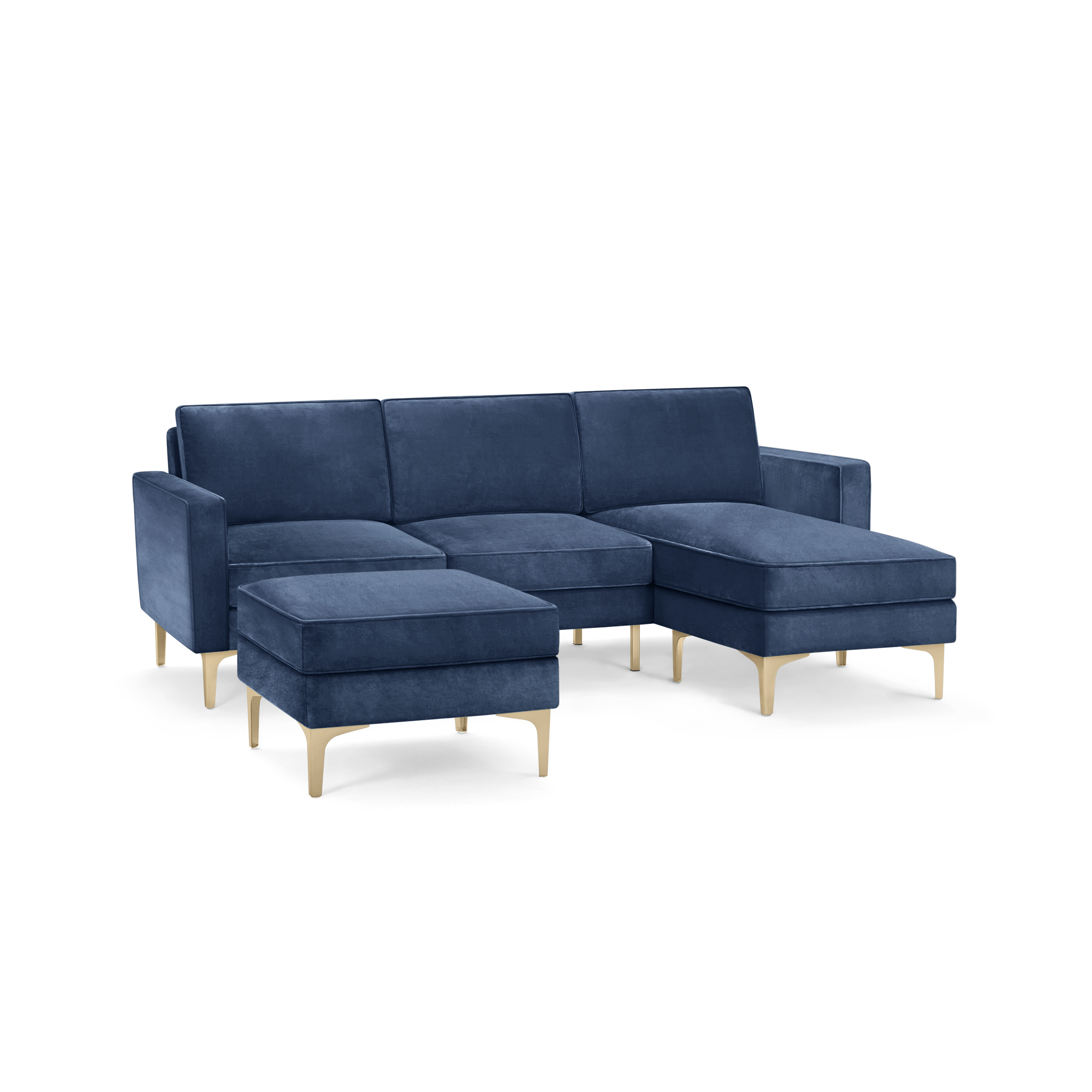 modern blue velvet sectional sofa with matching ottoman, featuring sleek metal legs and a clean, minimalist design