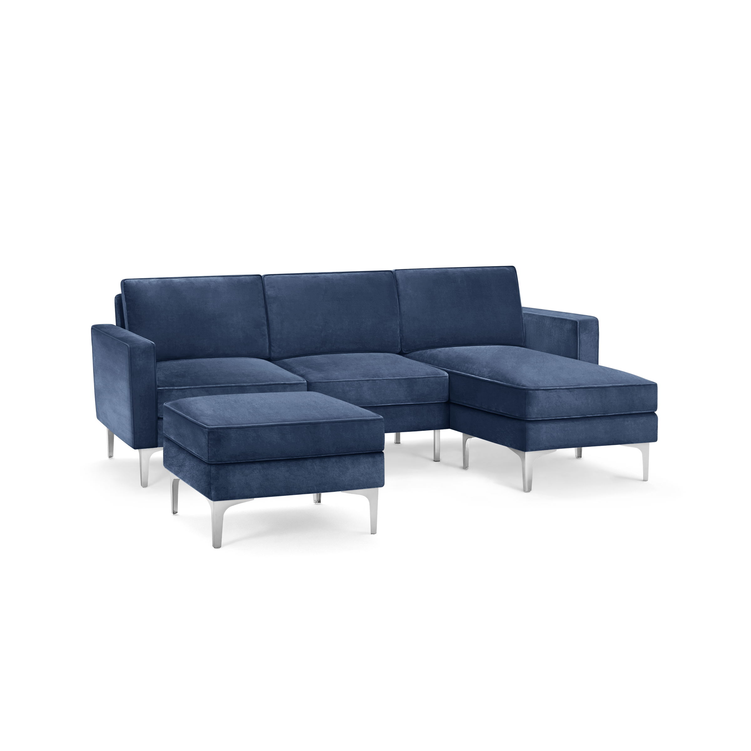 modern blue velvet sectional sofa with matching ottoman, featuring sleek metal legs and sleek design on the right side