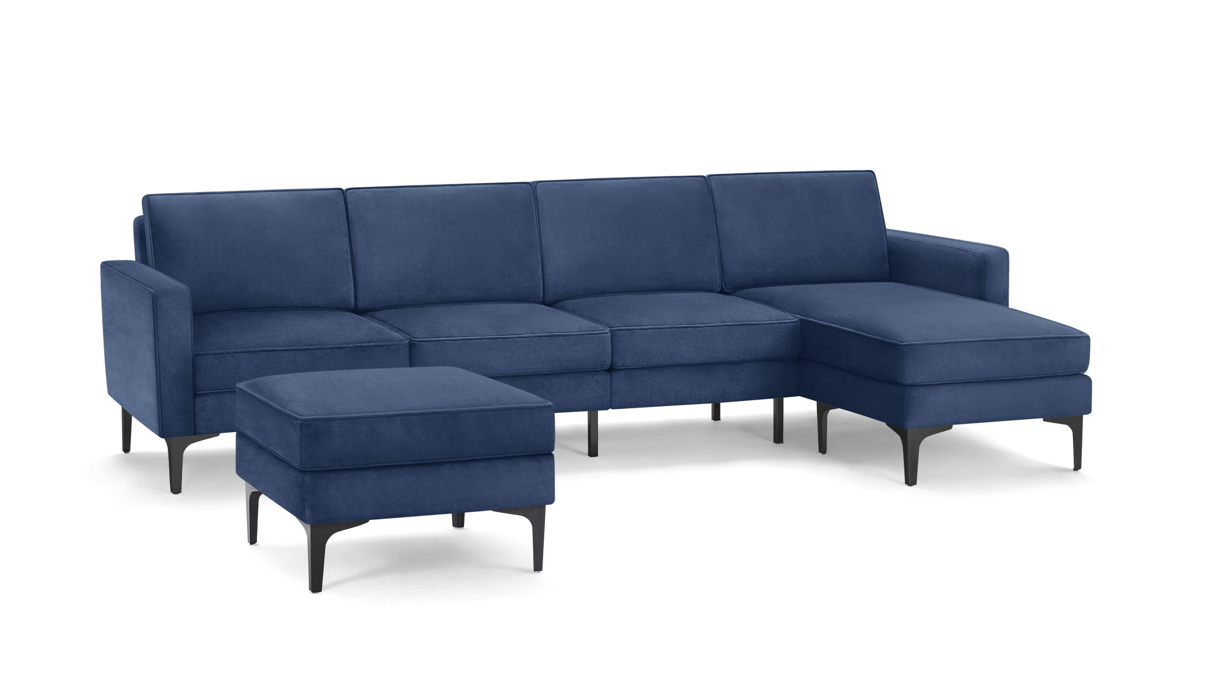 modern blue velvet sectional sofa with matching ottoman, featuring sleek black metal legs, and clean lines on the back, on a dark blue background