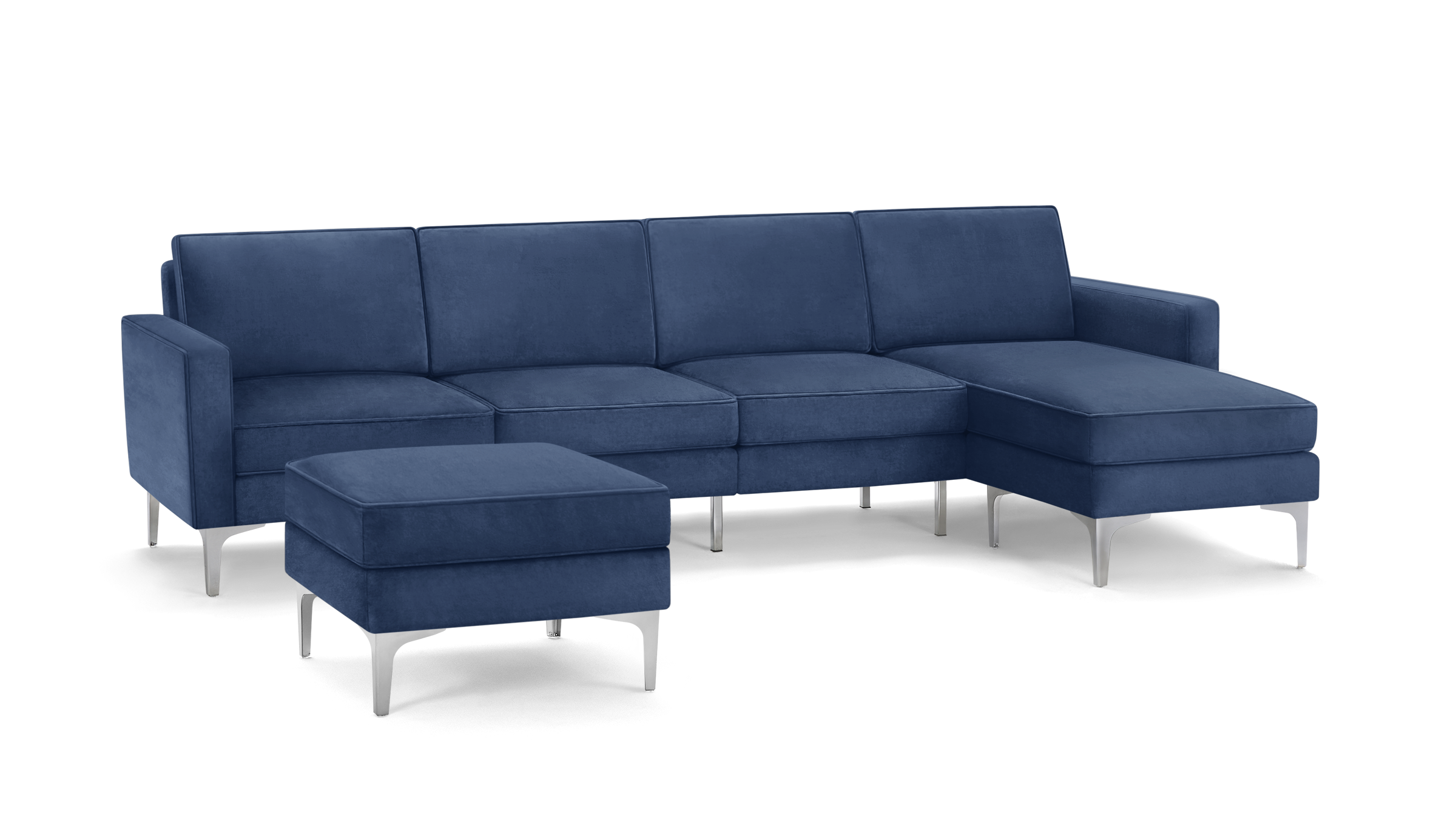 modern blue velvet sectional sofa with matching ottoman, featuring sleek metal legs and sleek design on the right side