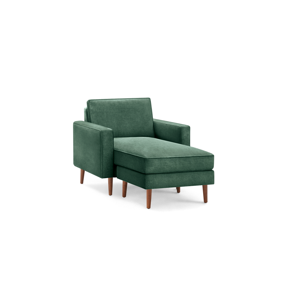 modern green upholstered chaise lounge chair with wooden legs and a sleek backrest, featuring a sleek, modern design