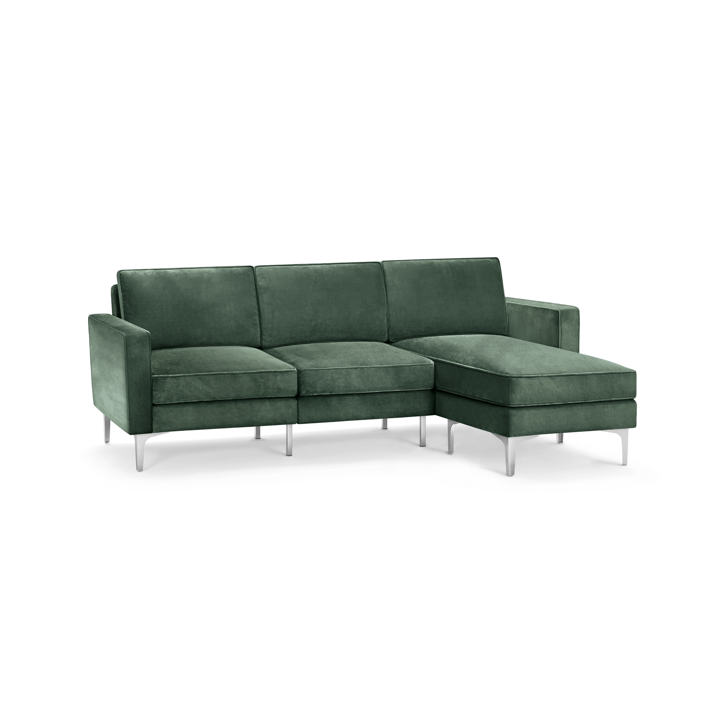 modern green velvet sectional sofa with chrome legs and clean lines on the back, featuring a clean, minimalist design