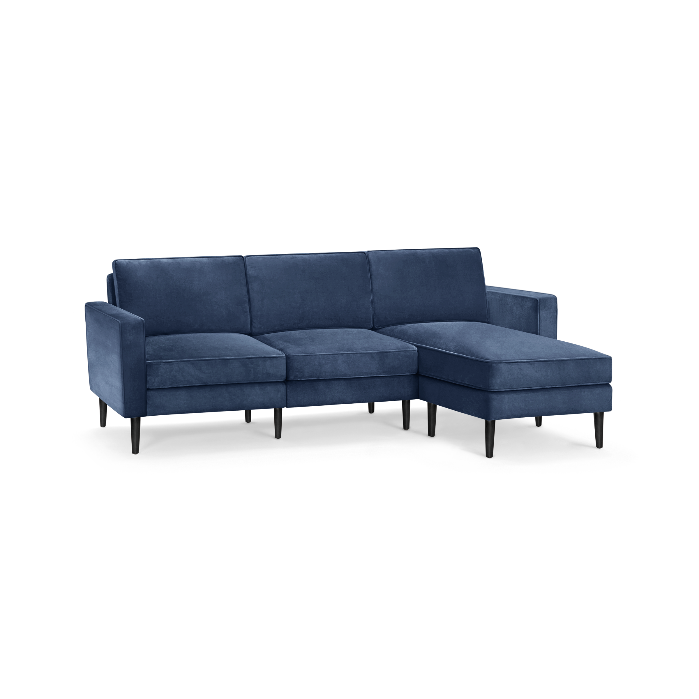 modern blue velvet sectional sofa with black metal legs and clean lines on the back, featuring a chaise lounge and matching ottoman