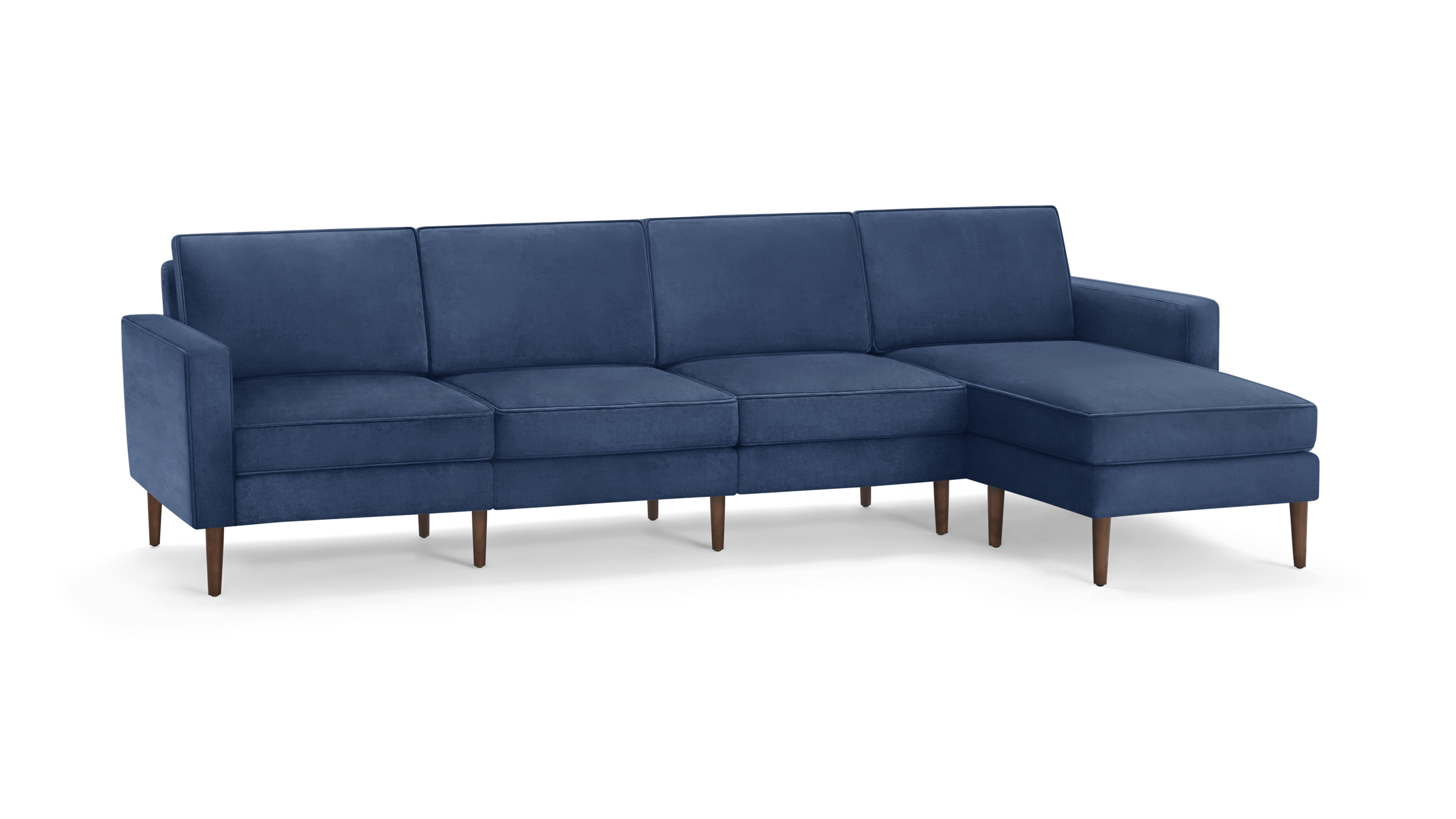 modern navy blue velvet sectional sofa with wooden legs and matching ottoman, featuring a clean, minimal design