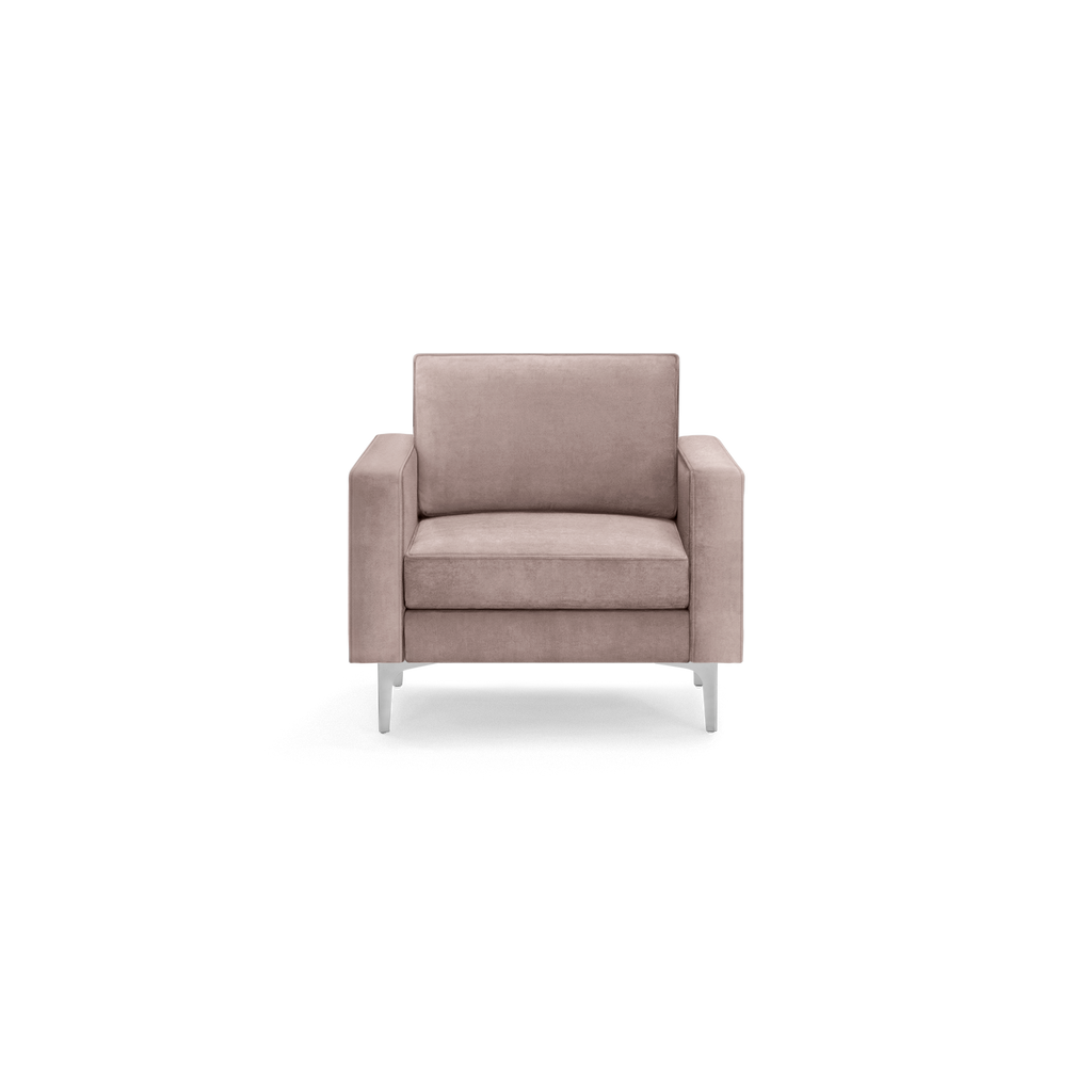 modern light pink velvet armchair with sleek metal legs and a sleek backrest, featuring a sleek, modern design