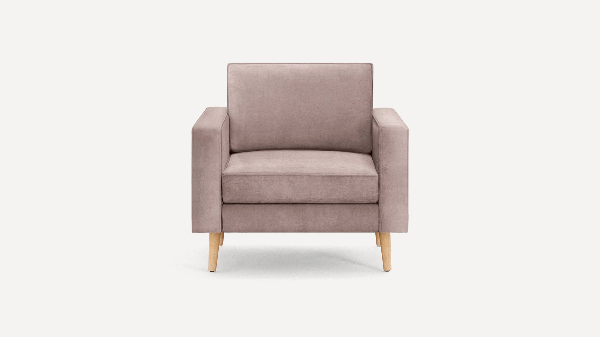 Front view of a modern single-seater armchair with light pink upholstery and light wooden legs on a white background.