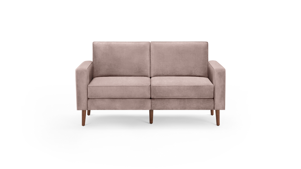 modern light pink velvet loveseat with wooden legs and sleek backrests, featuring a clean, minimalist design