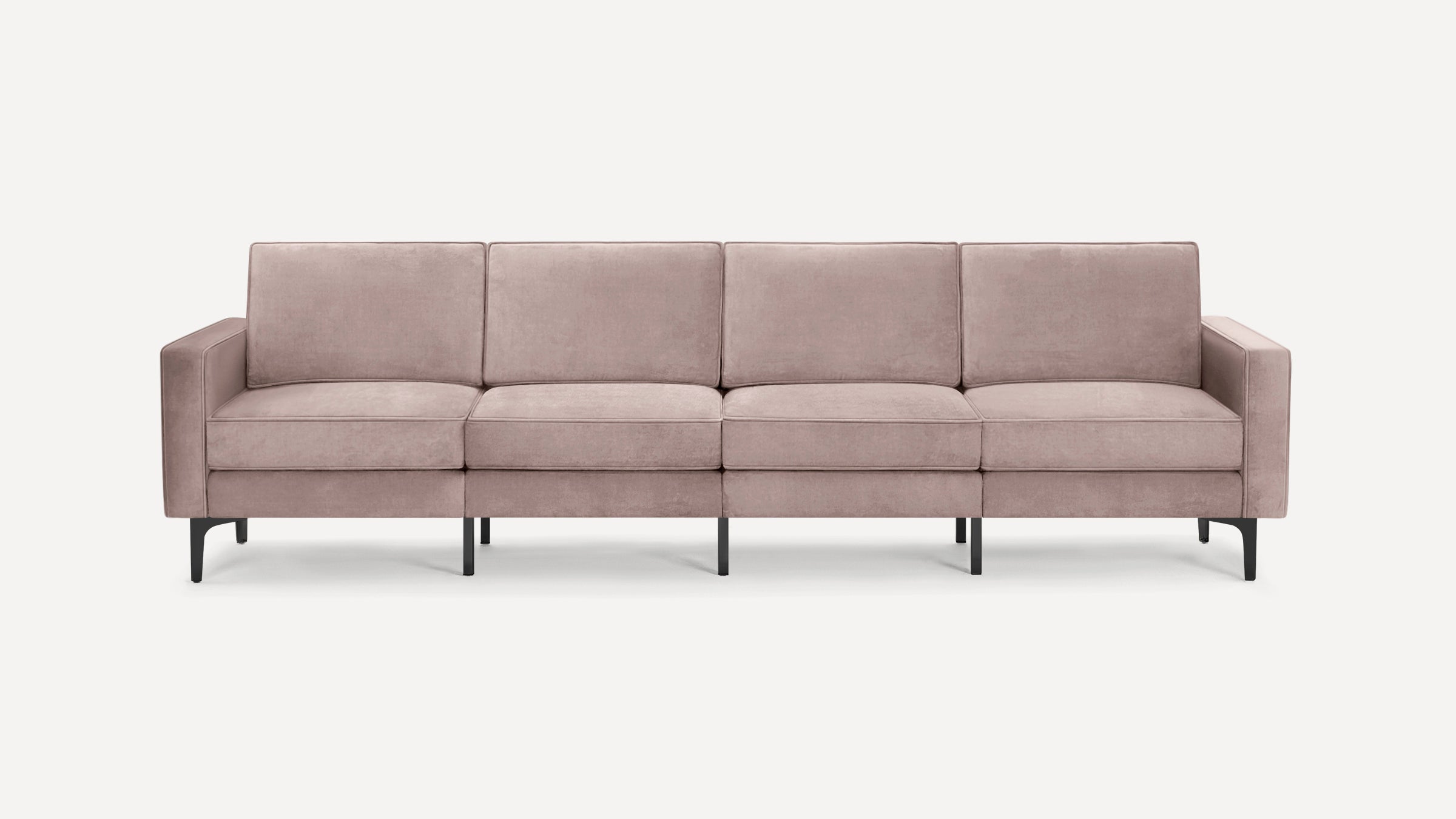 Modern four-seater sofa with soft mauve upholstery, square arms, and black slender metal legs on a white background.