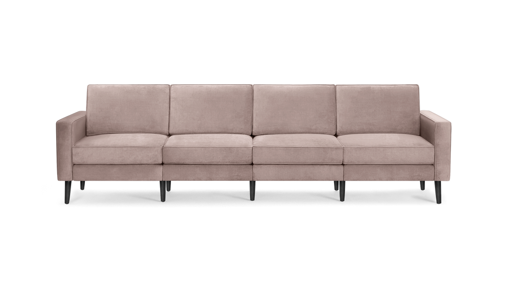 modern light pink velvet sofa with black metal legs and clean lines on the back, featuring a clean, minimalist design