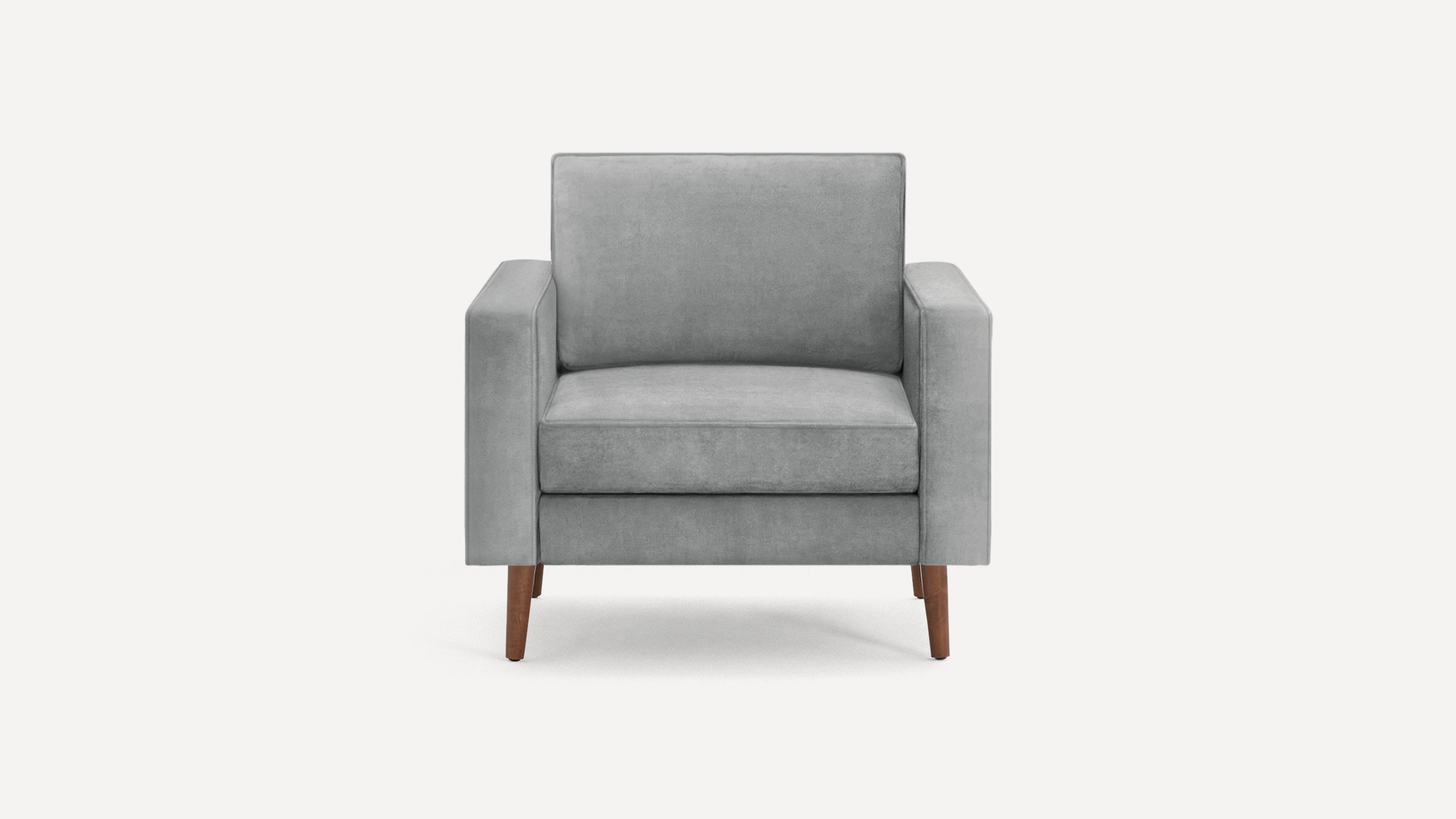 Front view of a modern gray upholstered armchair with wooden legs on a white background.