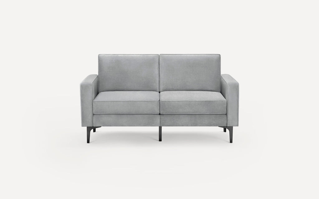 Light gray velvet upholstered two-seater sofa with straight arms and black metal legs against white background.