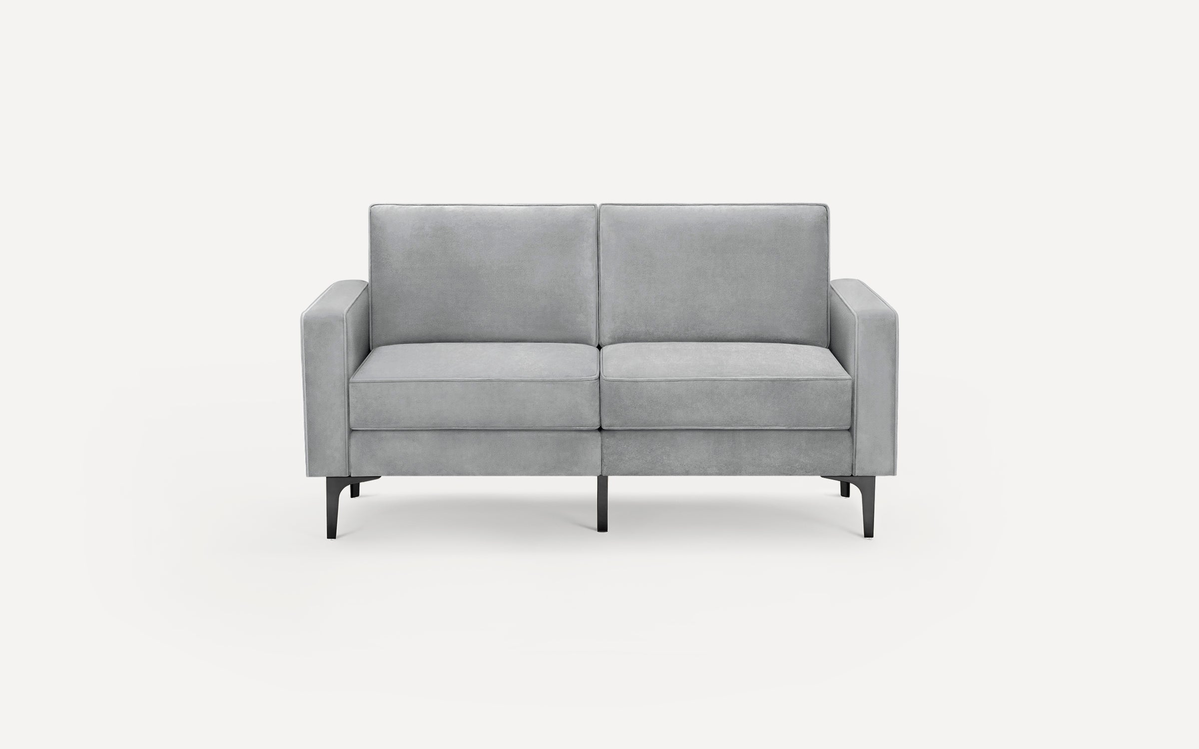 Light gray velvet upholstered two-seater sofa with straight arms and black metal legs against white background.
