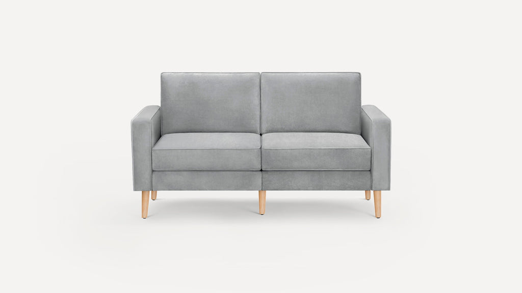 Modern two-seater sofa upholstered in light gray fabric with cushioned backrest, armrests, and wooden tapered legs.