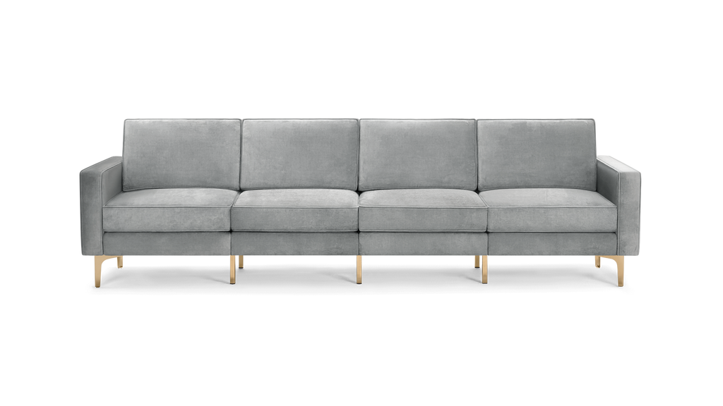 modern gray velvet sofa with gold metal legs and clean lines on the back, featuring a clean, modern design