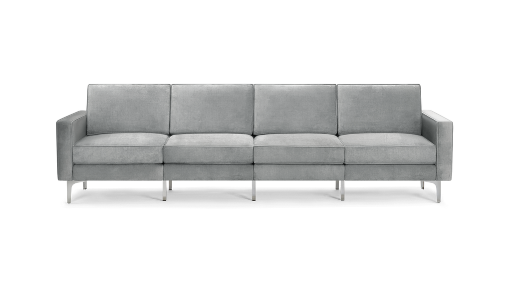modern gray velvet sofa with chrome legs and clean lines on the back, featuring a sleek design and clean lines on the arms