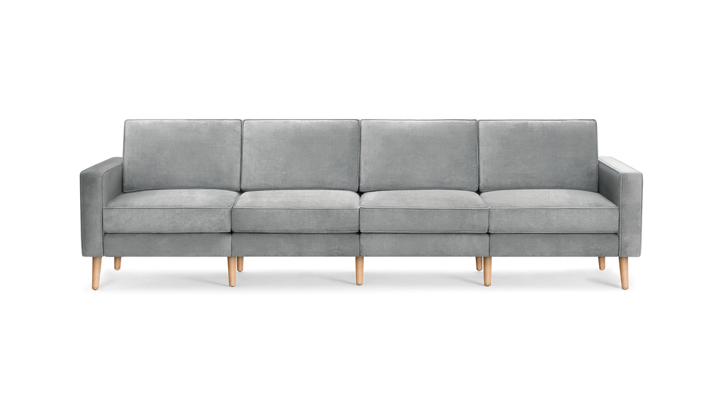 modern light gray velvet sofa with wooden legs and clean lines on the back, featuring a clean, modern design