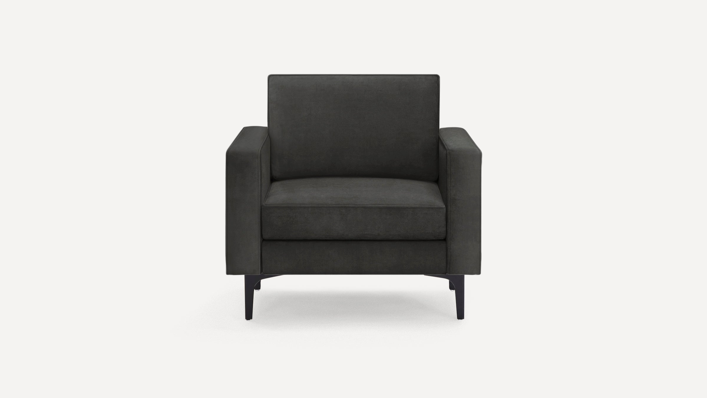 Modern dark gray armchair with clean lines, thick cushions, and slender black legs on a white background.
