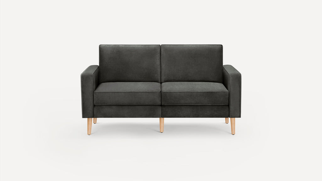 Modern dark gray two-seater sofa with clean lines and light wooden legs, set against a plain white background.