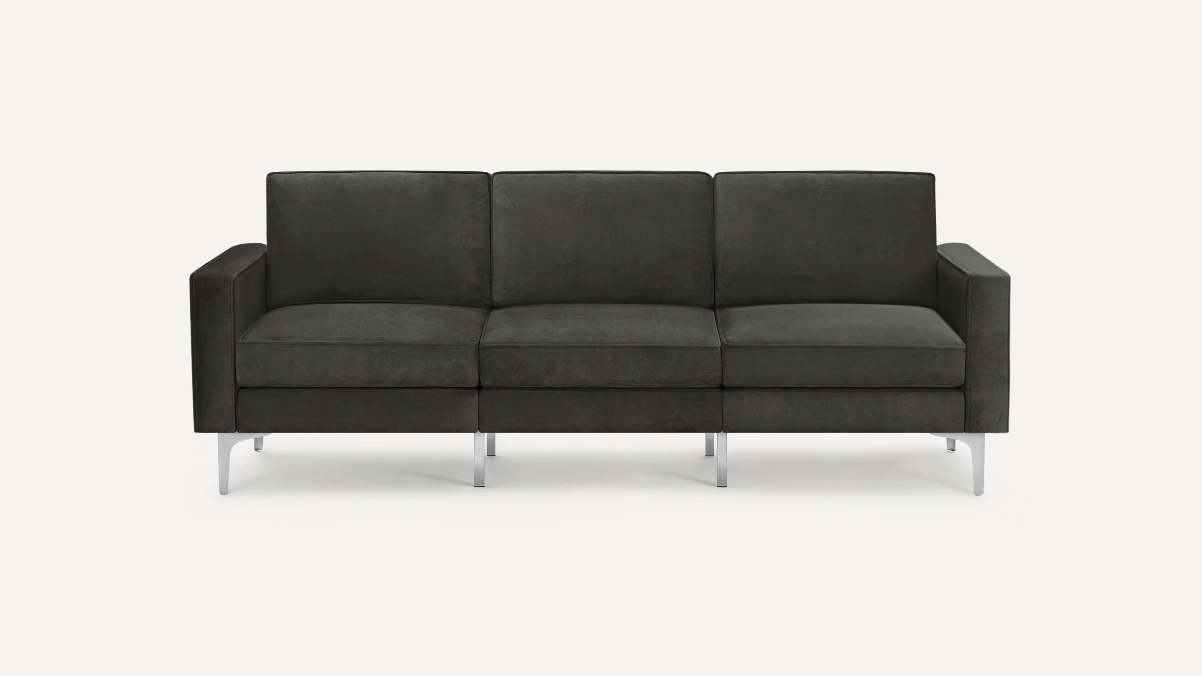 Modern three-seater dark gray velvet sofa with clean lines, square arms, and sleek silver metal legs on a white background.