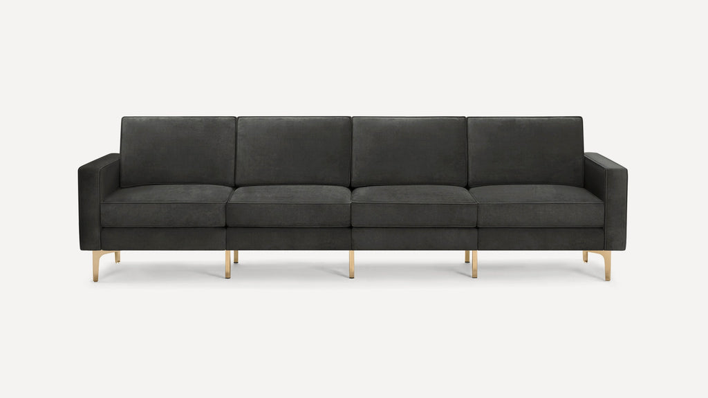 Modern dark gray four-seater sofa with sleek gold metal legs and clean rectangular cushions on a white background.