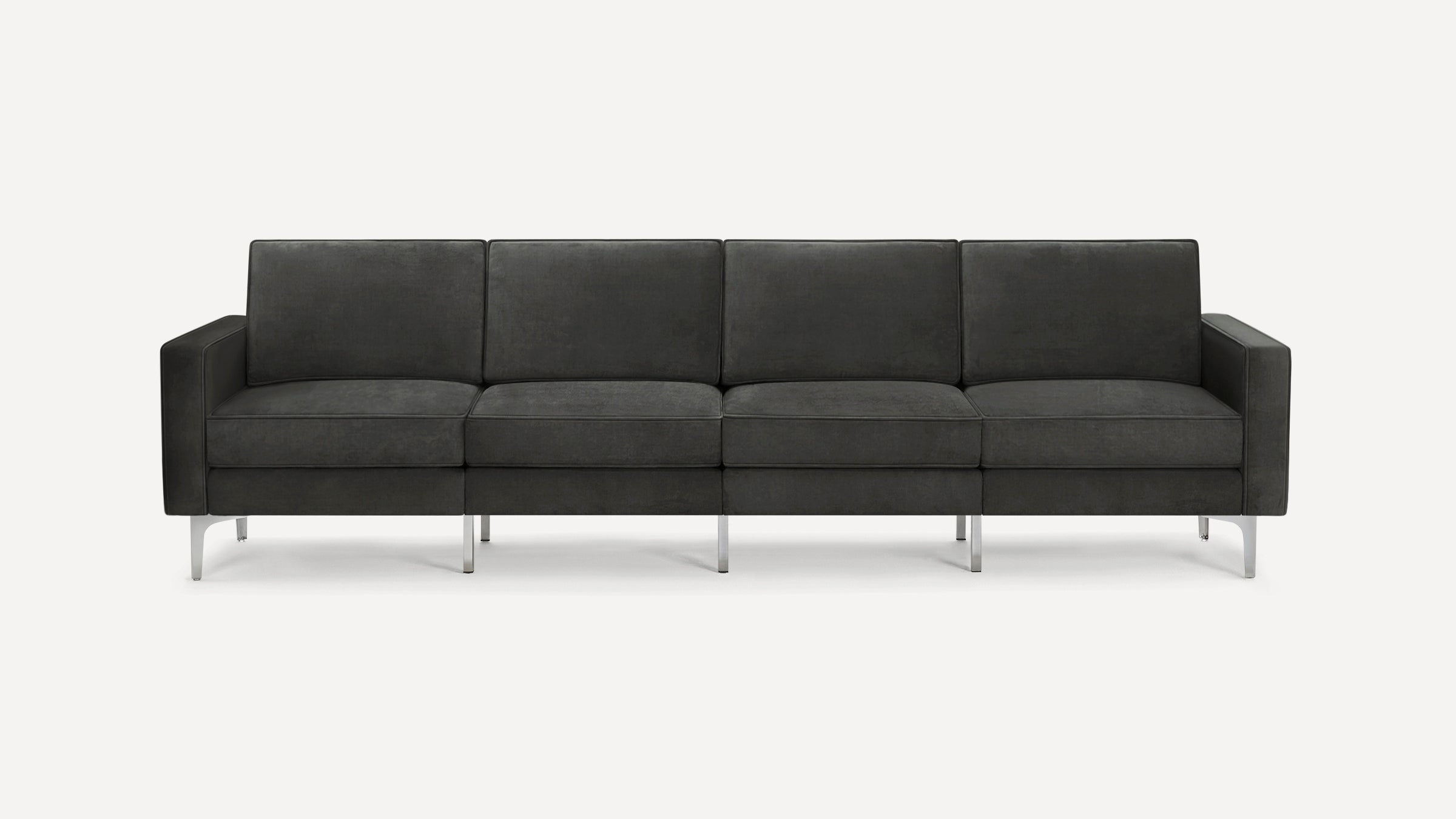 Dark gray modern four-seat sofa with clean lines, rectangular cushions, and metal legs, set against a plain white background.