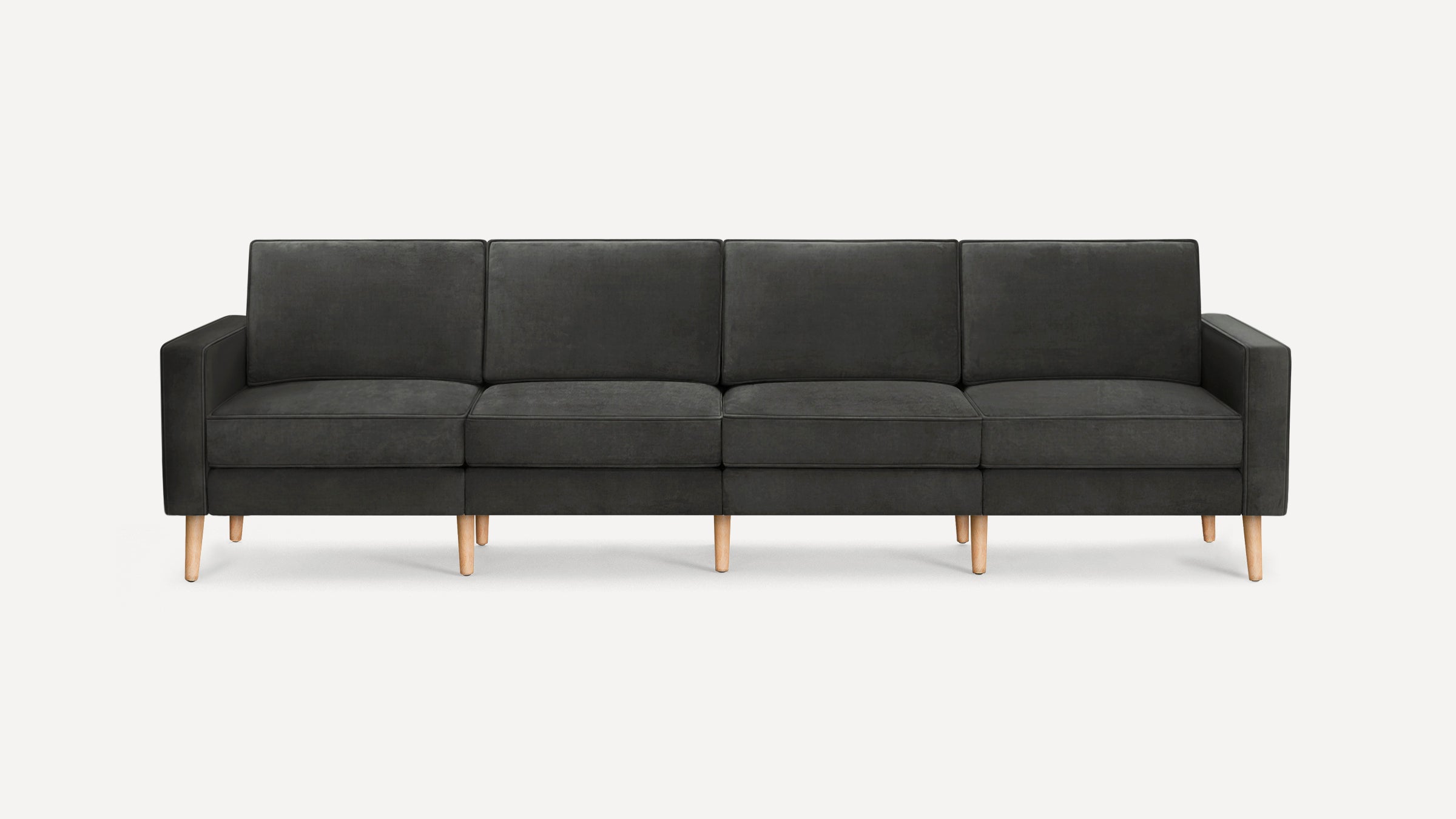Modern four-seater dark gray fabric sofa with straight arms and light wooden legs, set against a plain white background.