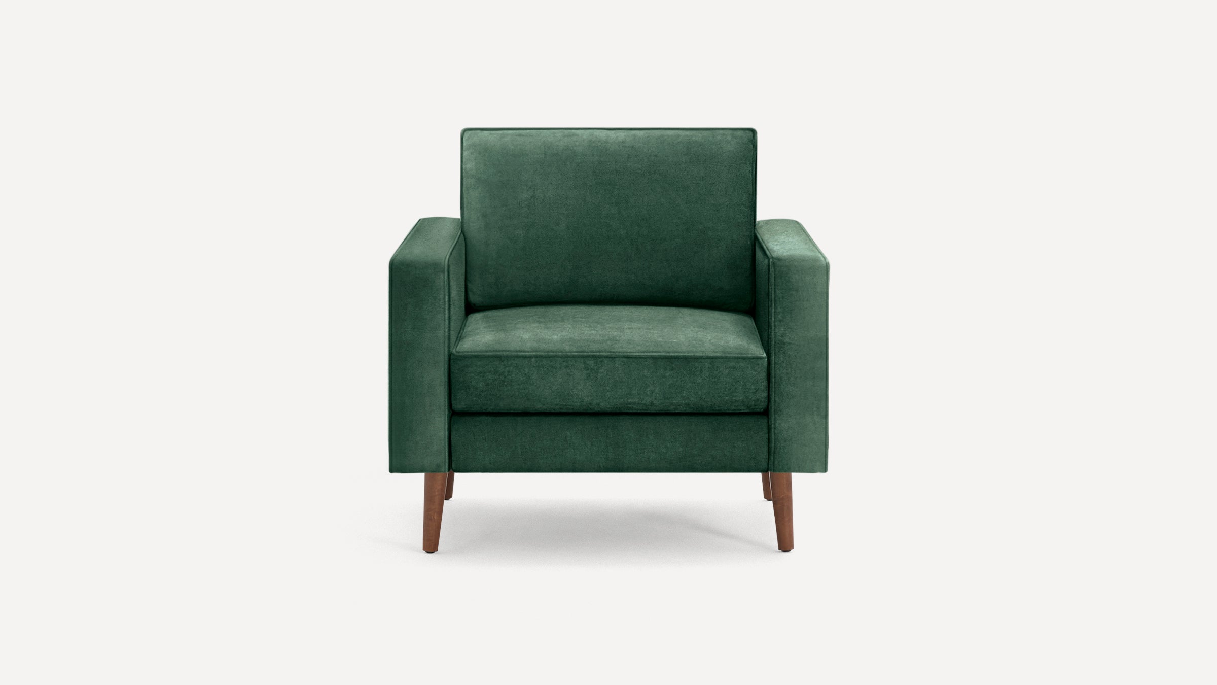 Front view of a modern, dark green upholstered armchair with wooden legs and square armrests on a white background.