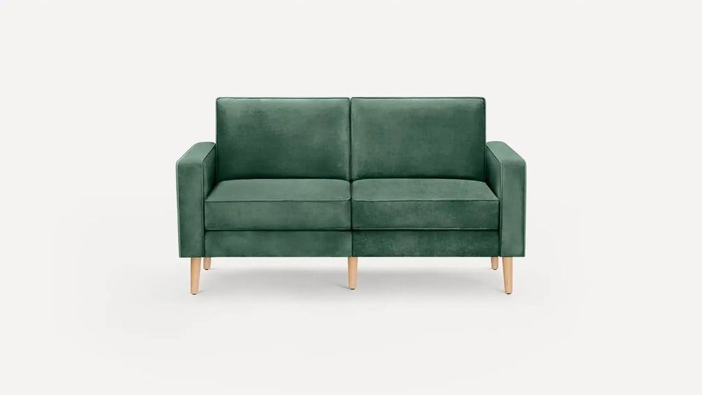 modern green velvet sofa with wooden legs and back cushions