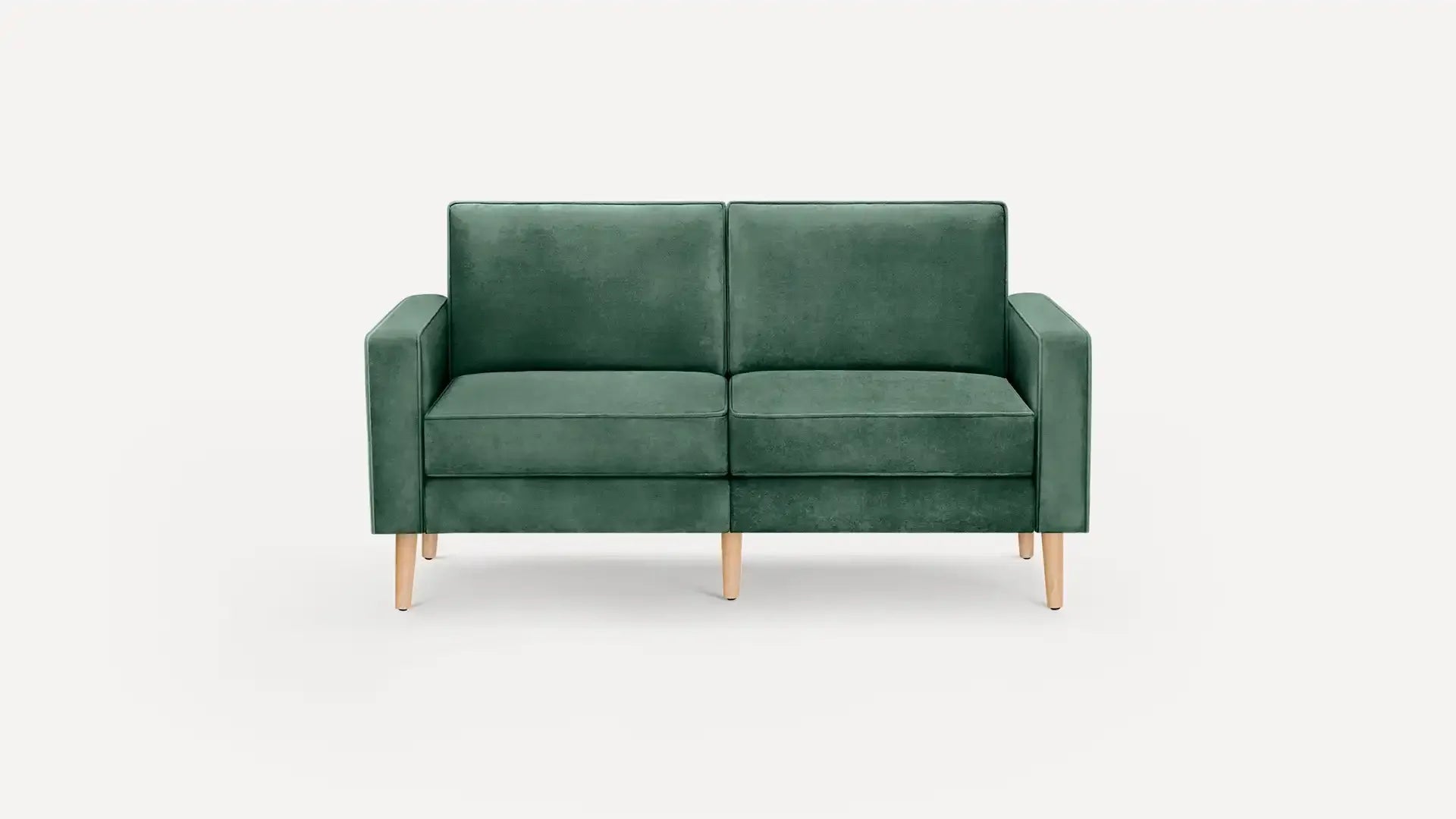 modern green velvet sofa with wooden legs and back cushions