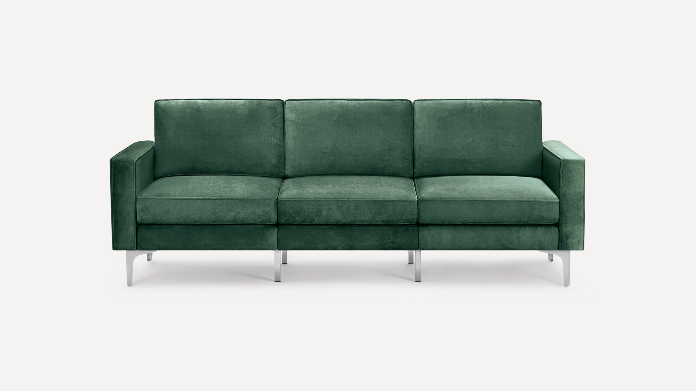 Modern three-seater sofa upholstered in dark green velvet fabric with rectangular cushions and sleek metal legs.