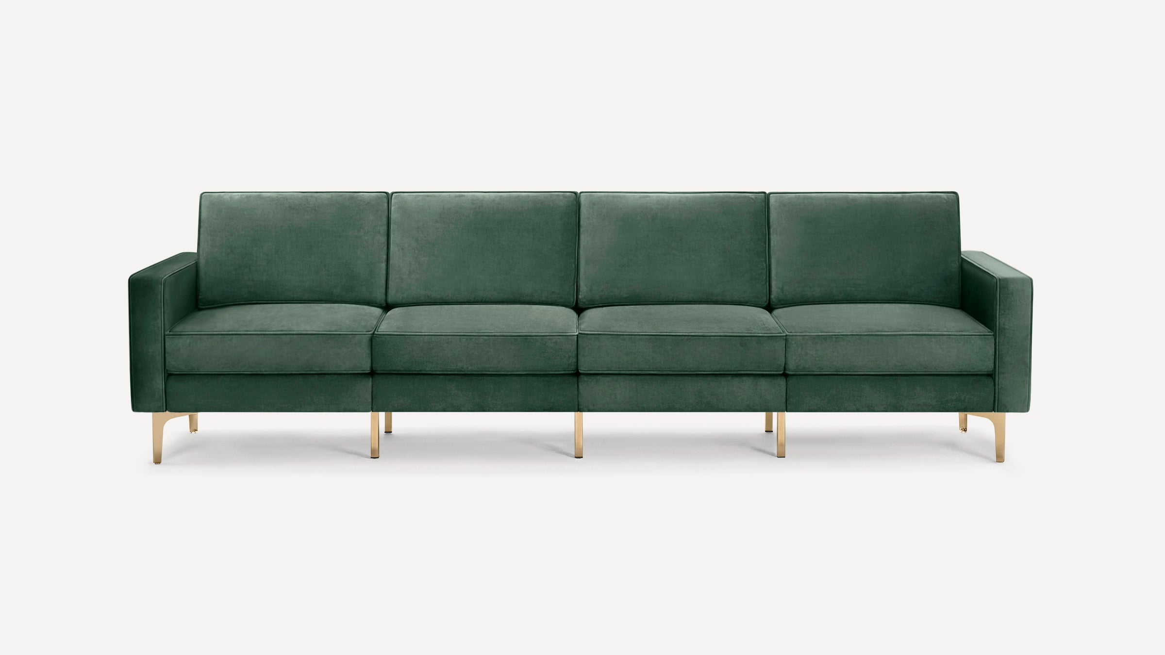Dark green velvet modern four-seat sofa with square cushions and gold metal legs on a white background.