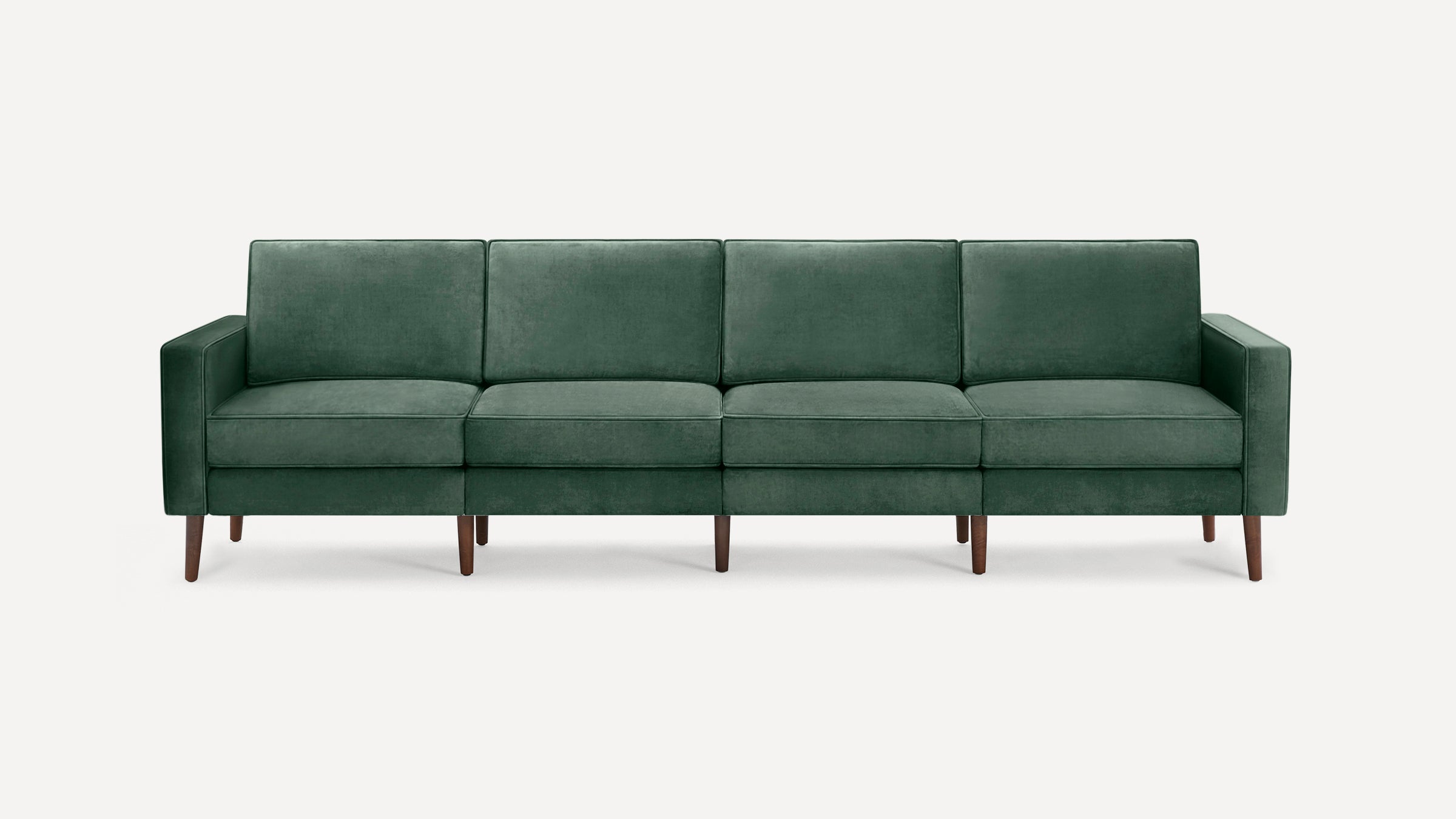 Modern four-seater sofa with dark green velvet upholstery and slim wooden legs, featuring clean lines and square armrests.