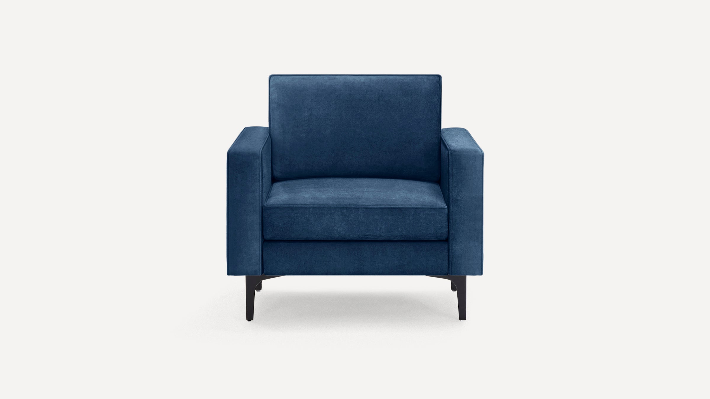 Front view of a modern navy blue upholstered armchair with straight arms and black metal legs on a white background.