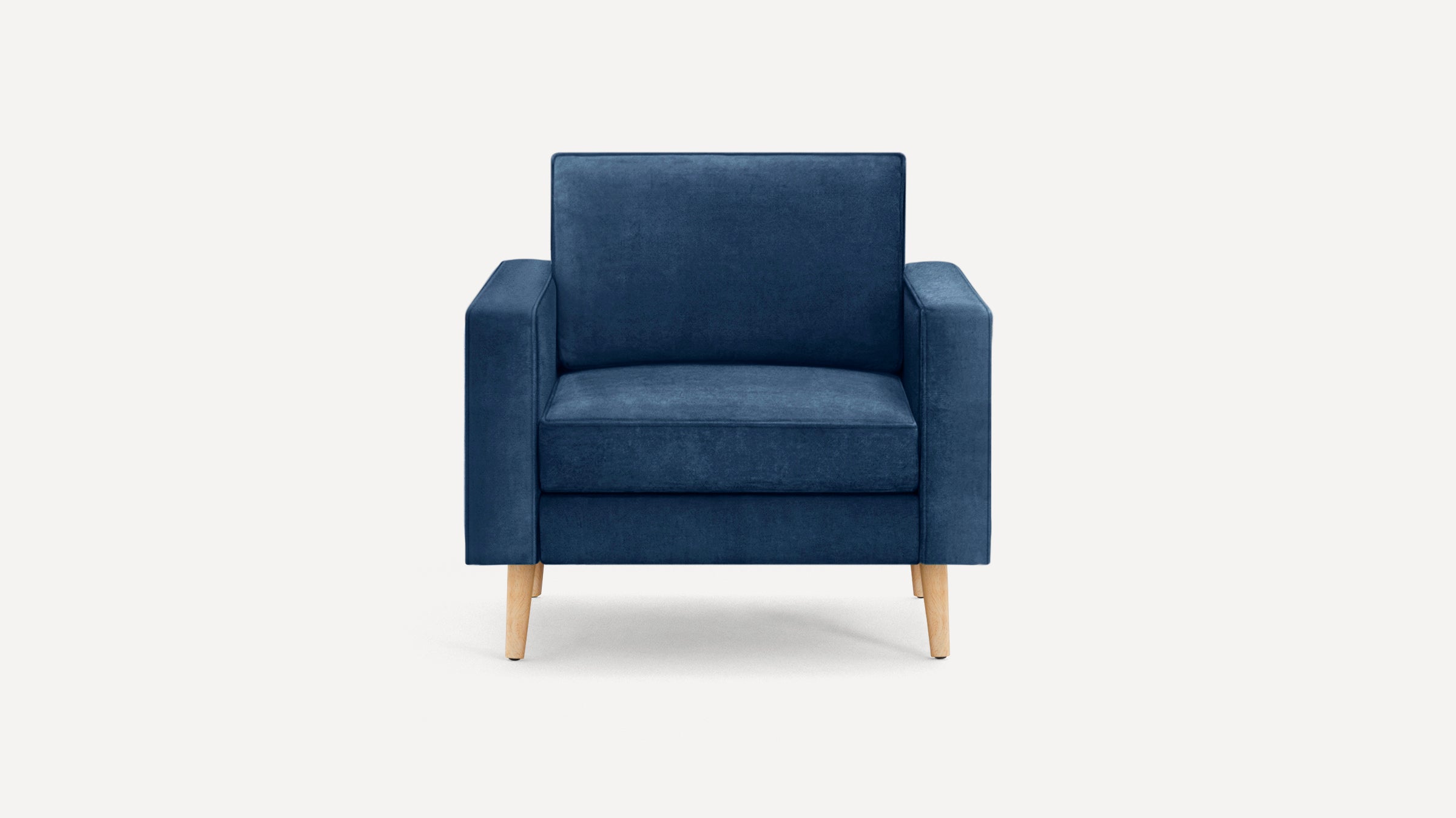 Modern navy blue armchair with square arms, cushioned seat and backrest, supported by four light wooden legs.