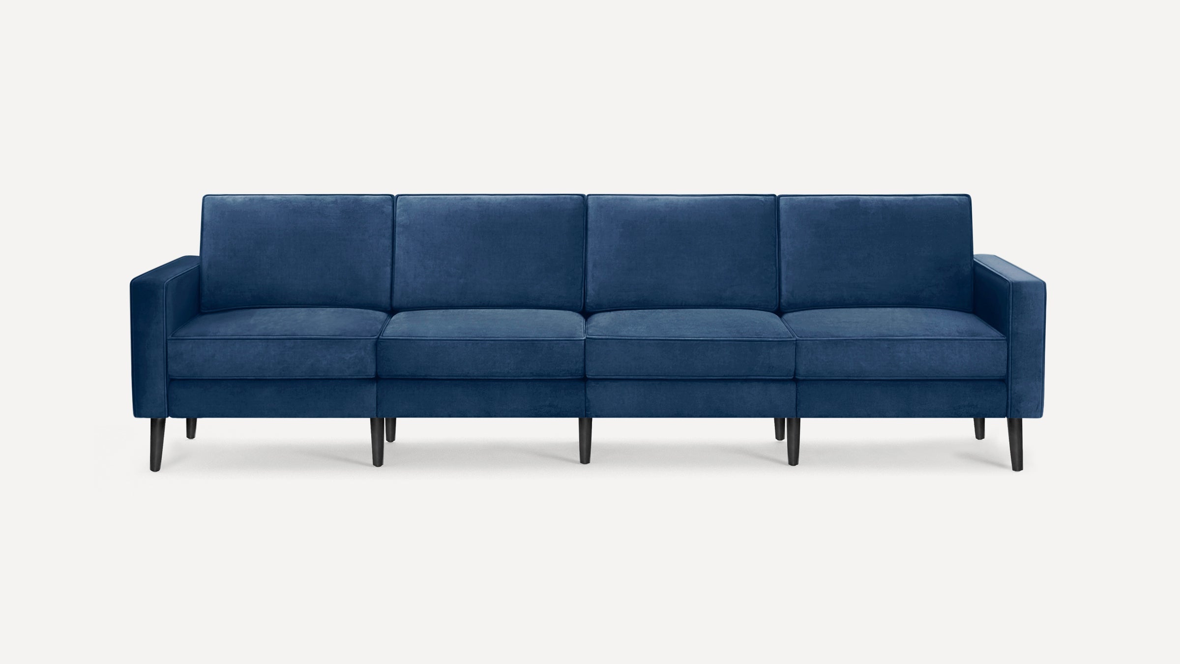 Four-seat modern sofa with deep blue upholstery and black tapered wooden legs on a plain white background.