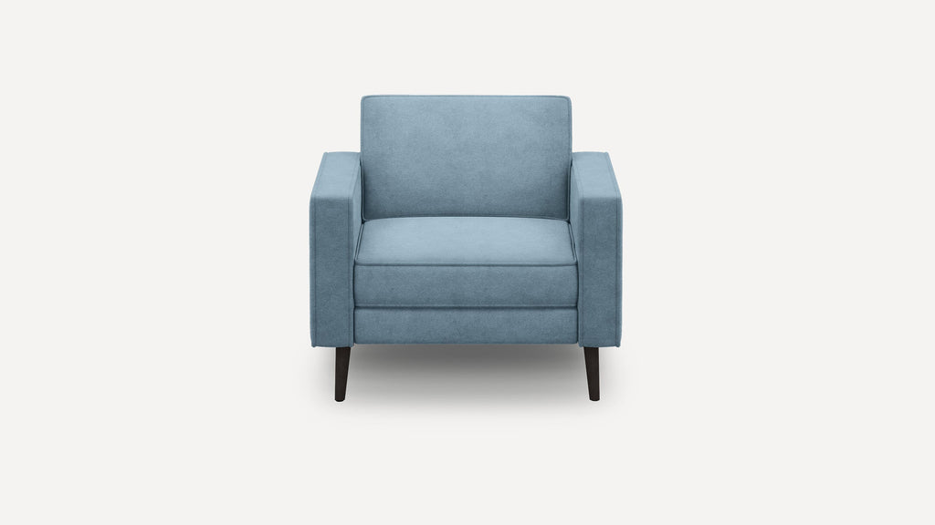 Front view of a modern light blue upholstered armchair with straight armrests and dark wooden legs on a white background.