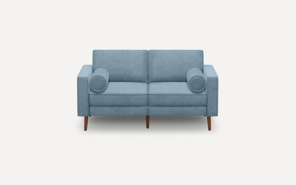 Two-seater modern light blue fabric sofa with clean lines, wooden tapered legs, and two cylindrical matching bolster pillows.