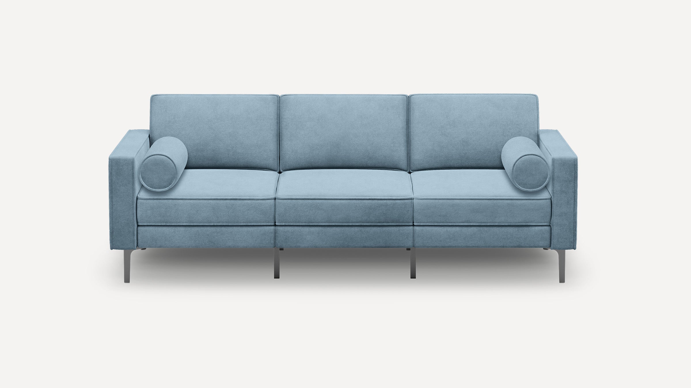 Light blue modern three-seater sofa with clean lines, metal legs, and cylindrical bolster pillows on each armrest.