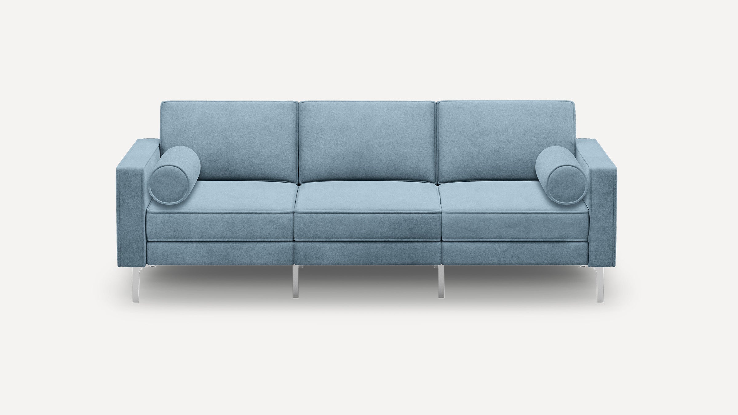 Modern light blue three-seater sofa with straight arms, three back cushions, seat cushions, cylindrical bolster pillows, and slim metal legs.