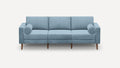 modern light blue fabric sofa with wooden legs and rounded cushions on a white background