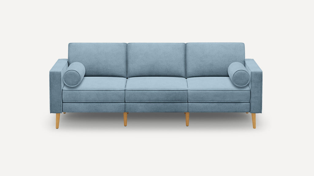 Modern light blue three-seater sofa with cylindrical arm cushions and wooden tapered legs, set against a plain background.