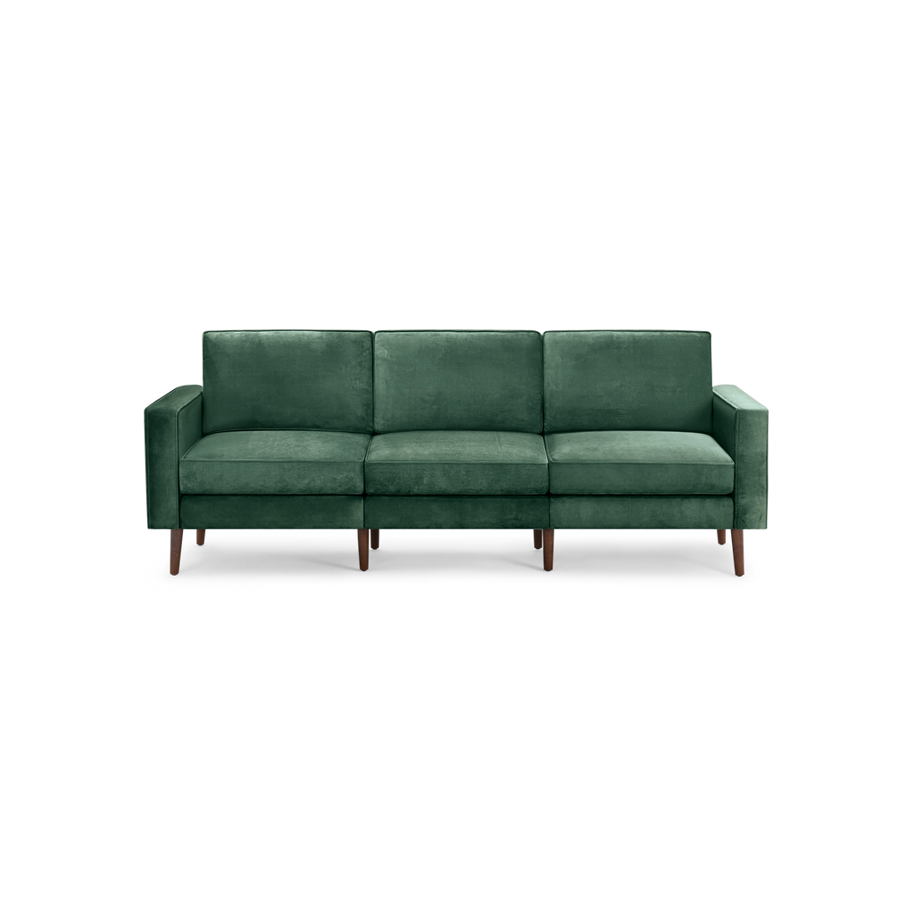modern green velvet sofa with wooden legs and a deep green upholstery fabric sofa cushioned with a deep green velvet upholstery