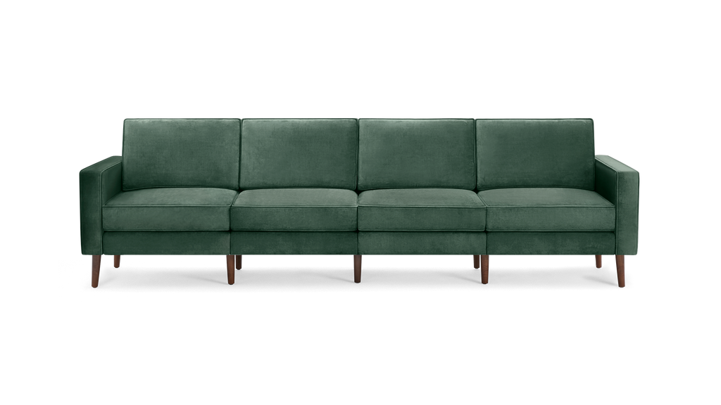modern green velvet sofa with wooden legs and clean lines on the back, featuring a clean, modern design